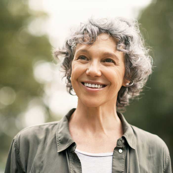 Shot of a happy senior woman spending the day in the park